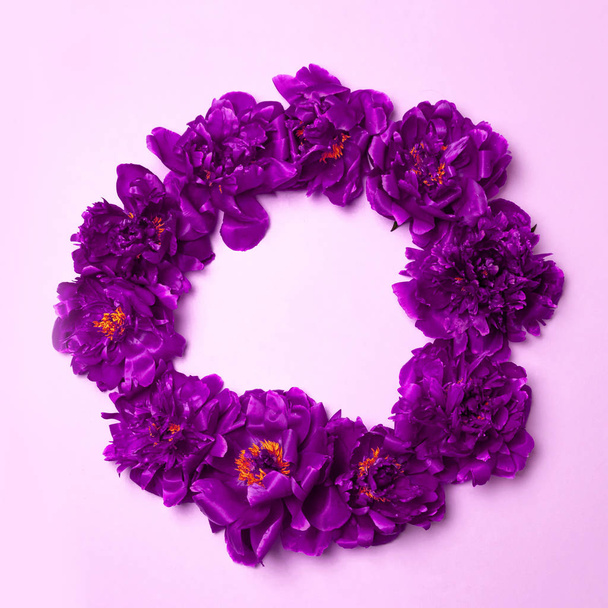 Beautiful spring purple flowers frame on on a pastel light background - Zdjęcie, obraz