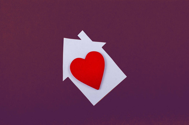 Little paper house and a heart in hand - Photo, Image