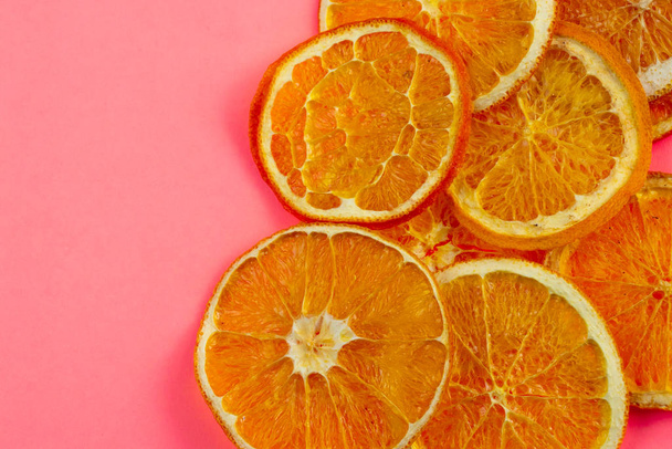 dried sliced orange on an isolated background, fruit chips - Photo, Image