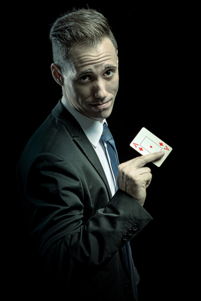 Businessman showing ace card - Foto, afbeelding