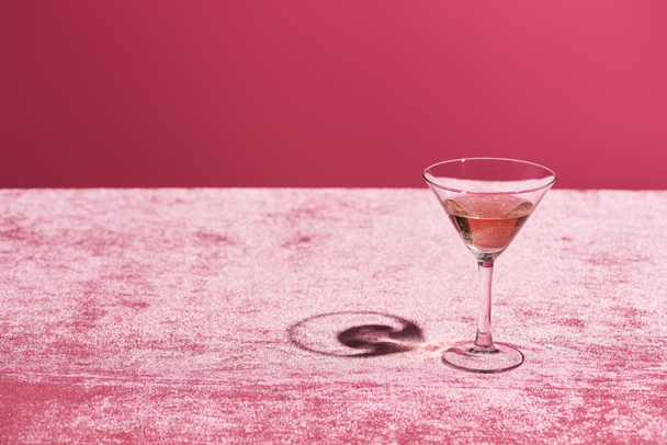 rose wine in glass on velour pink cloth isolated on pink, girlish concept - Fotó, kép