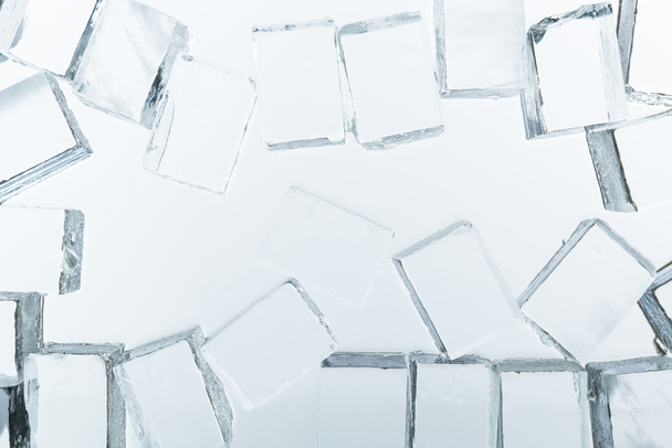 top view of transparent clear square ice cubes on mirror - Fotoğraf, Görsel