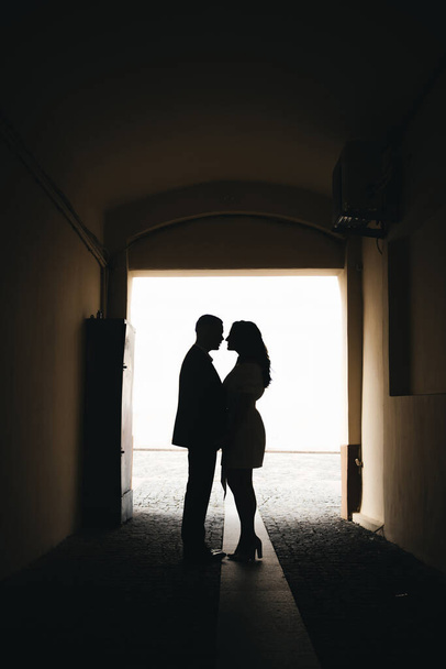 Silhouettes of two loving people. Photos of the bride and groom  - Photo, image