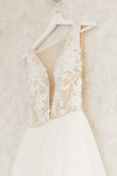 wedding dress hanging on the mirror, bride's morning - 写真・画像