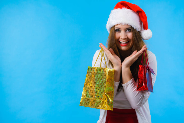 Happy Christmas woman holds gifts bag - Foto, imagen