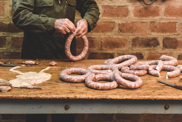 Hands making homemade sausages, Patagonia, Argentina - Photo, Image