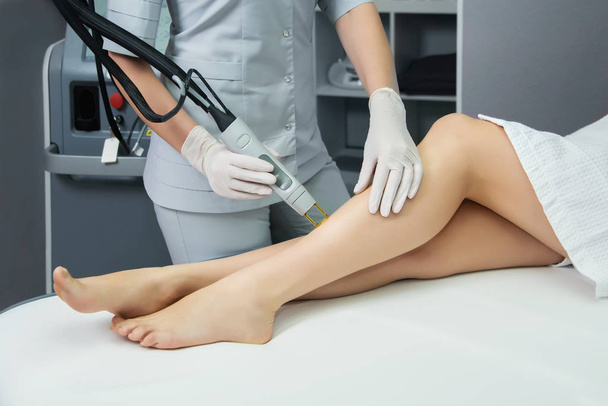Hair removal cosmetology procedure from a therapist at cosmetic  - Fotografie, Obrázek