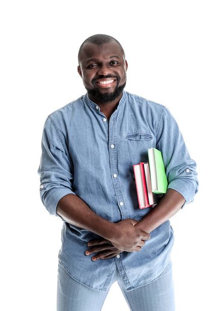 African-American man with books on white background - Fotografie, Obrázek