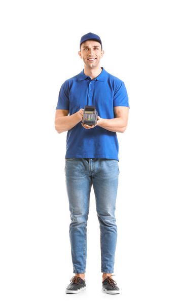Delivery man with payment terminal on white background - Foto, afbeelding