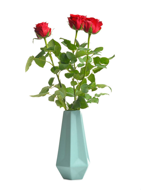 Vase with beautiful rose flowers on white background - Foto, Imagen