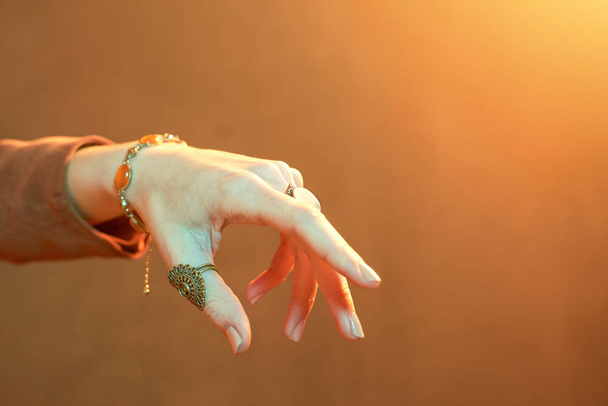 Witch hand full of jewelry - Photo, Image