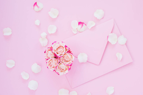 Framework of pink roses and gifts. Spring concept, flat lay, copy space - Photo, Image