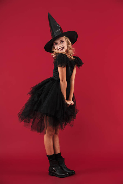 Pretty little girl witch in carnival halloween costume - Fotoğraf, Görsel