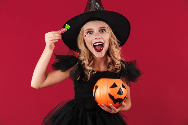 Witch in carnival halloween costume - Фото, изображение