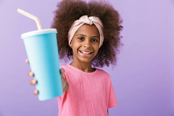 Positive young african girl kid give you soda. - Foto, Imagem