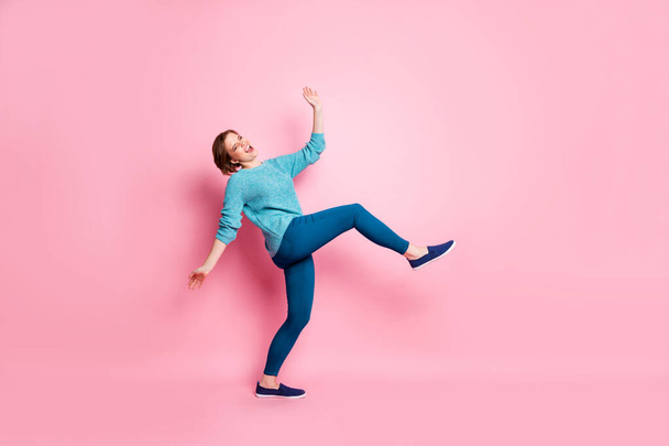 Full length body size view of her she nice attractive lovely funky cheerful cheery clumsy brown-haired woman having fun fooling isolated over pink pastel color background - 写真・画像