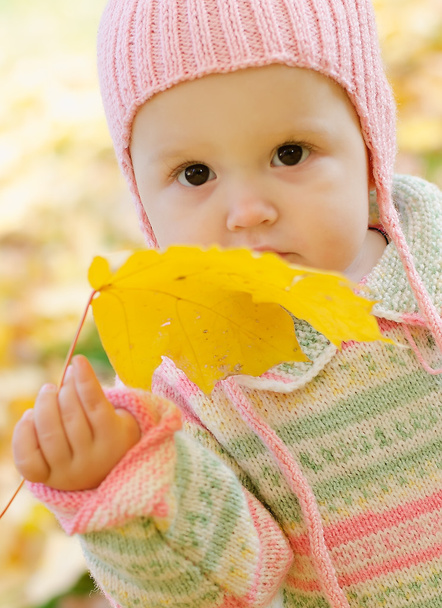 Girl with maple leaf - Фото, зображення