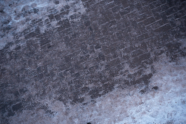 tracks asphalt snow, ice, human tracks from shoes, snow weather - Fotó, kép