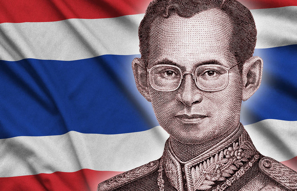 Portrait of King Bhumibol Adulyadej from 50 Baht Thailand money bill close on Thailand flag background - Photo, Image