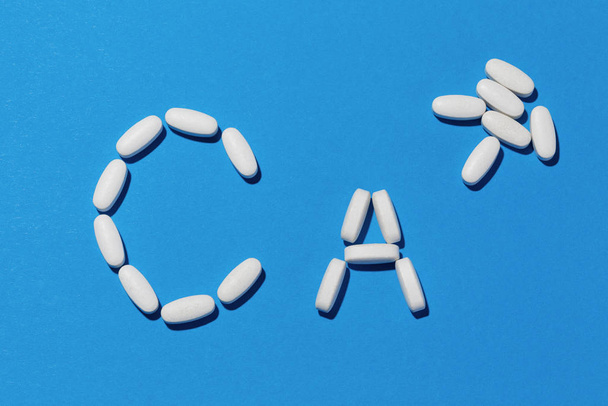 Chemical element calcium sign made of supplement pills. - Foto, Imagen