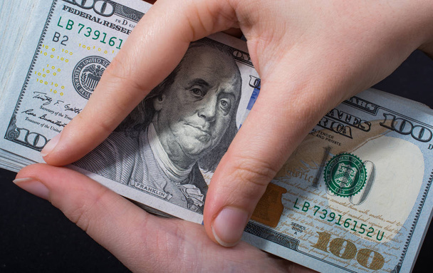 Hand holding American dollar  isolated on white background - Photo, Image