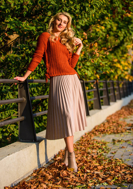 Fall fashion. Adorable lady enjoy sunny autumn. Fashionable clothes. Girl gorgeous blonde. Femininity and tenderness. Woman walking in autumn park. Pleated skirt fashion trend. Autumn stylish outfit - Φωτογραφία, εικόνα