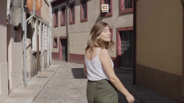 Young Woman Is Walking in Old City, Portugal - Кадри, відео