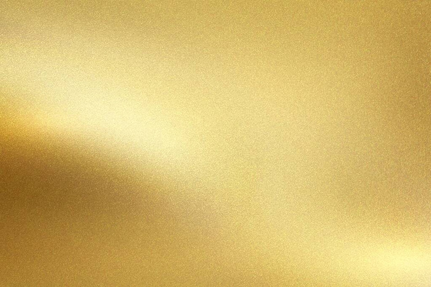Gold foil metal wall with glowing shiny light, abstract texture background - Photo, Image