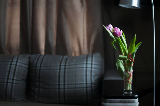 Flowers tulips in the vase in minimalism interior flat - Photo, Image