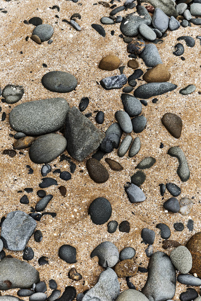 Struttura in pietra smorzata dalla sabbia bagnata e dallo spray marino
 - Foto, immagini