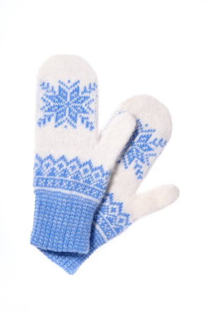 Warm woolen knitted mittens isolated on white background. Blue knitted mittens with pattern - Photo, Image