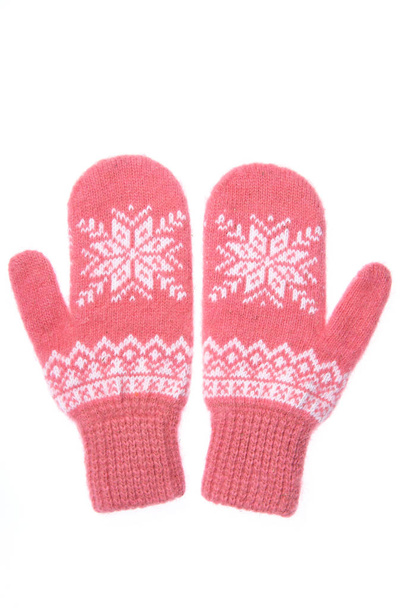 Warm woolen knitted mittens isolated on white background. Pink knitted mittens with pattern - Photo, Image