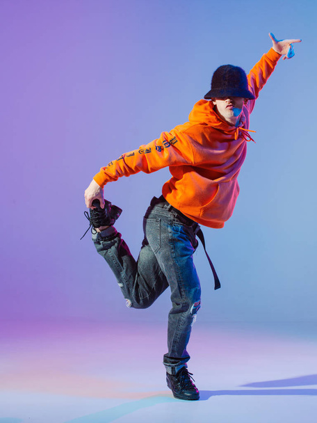 Boy dancing contemporary dance in studio. Breakdancing. - Фото, изображение