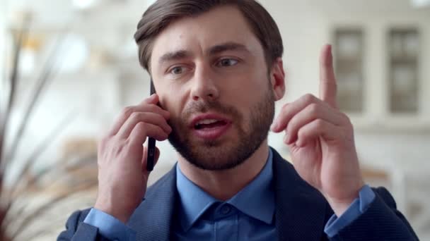 Focused business man getting new idea at remote office. Guy talking phone. - Video, Çekim