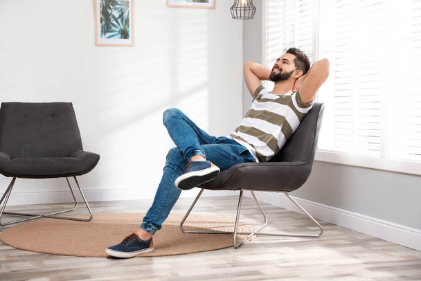 Young man relaxing at home. Peaceful rest - Fotó, kép