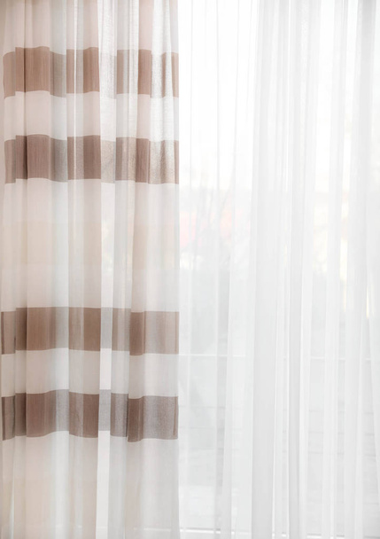 Window with elegant curtains in empty room - 写真・画像
