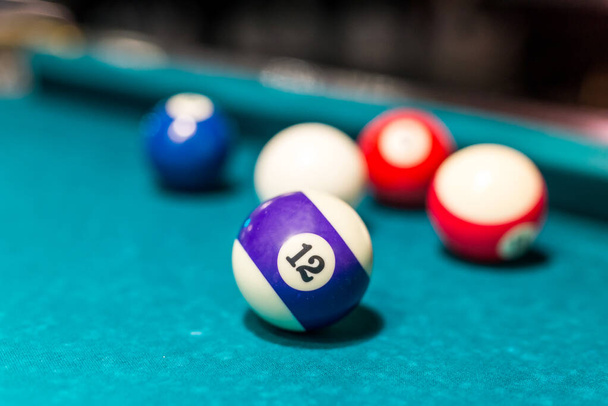 Selective focus on billiard ball number twelve - Photo, Image