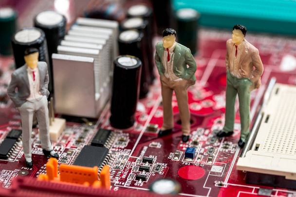 Three businessmen discuss motherboard . close up - Photo, Image
