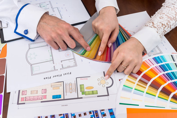 Creative designers choosing colors for dining room - 写真・画像