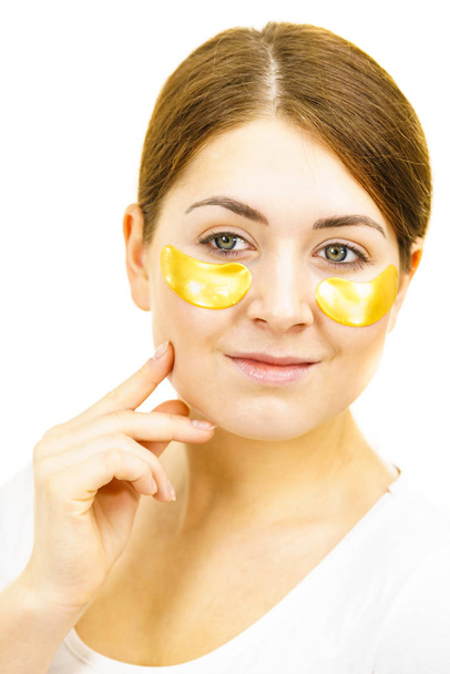 Woman with gold patches under eyes - Zdjęcie, obraz