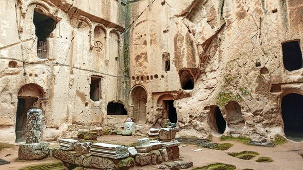 Ancient and secret Gumusler ruins and the monastery surrounded by walls and stones in Cappadocia, Gumusler, Nigde - Фото, изображение