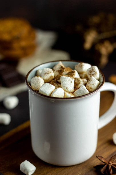 Hot chocolate with marshmallows in a white mug on a rusty background. Winter. Recipes. - Photo, Image