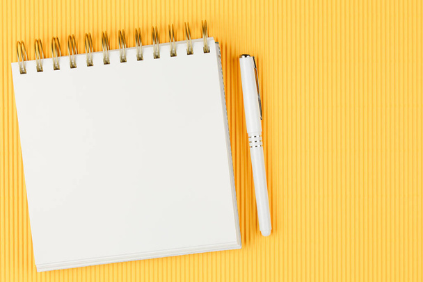 open notebook on corrugated yellow background - Photo, Image