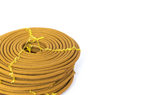 Studio shot stack of Asian round incense coils made of agarwood isolated on white - Photo, Image