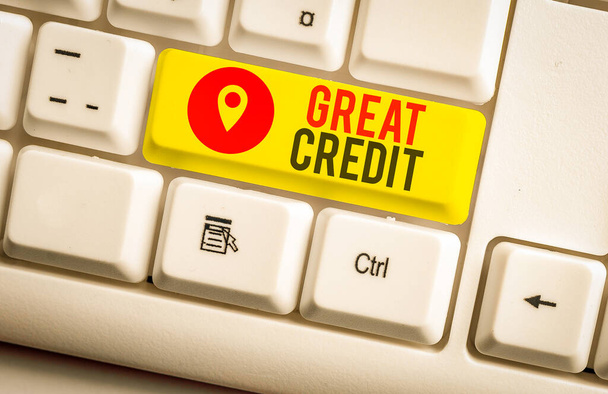 Text sign showing Great Credit. Business photo showcasing borrower has high credit score and is a safe credit risk White pc keyboard with empty note paper above white background key copy space - Photo, Image