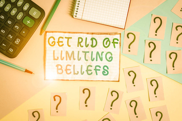 Handwriting text Get Rid Of Limiting Beliefs. Conceptual photo remove negative beliefs and think positively Mathematics stuff and writing equipment above pastel colours background - 写真・画像
