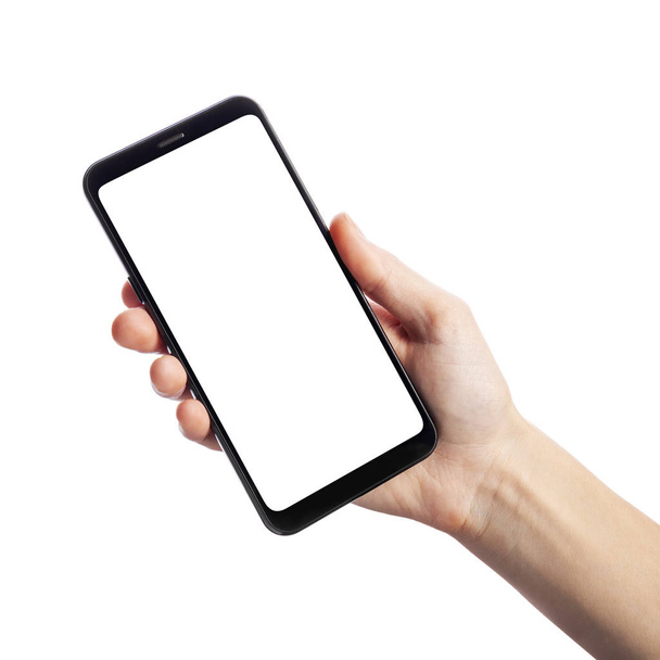 Woman holding smartphone with empty screen isolated on white background. Female hands touching screen, space for text - Photo, Image