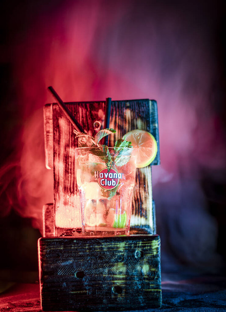 Wooden table with cocktail and smoke - Photo, Image