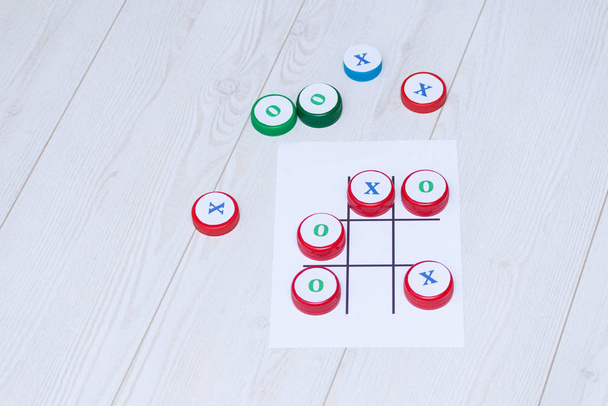 Handmade kids games with plastic caps for education, learning and motor skills. Craft for kids. - Photo, Image