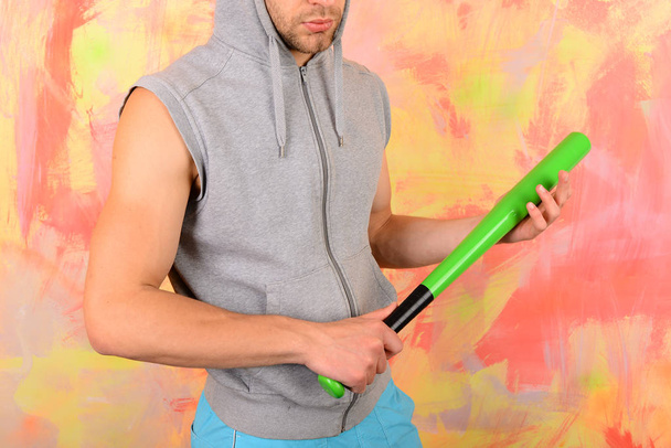 Man with bristle on colorful background. Guy in sleeveless hoodie - Fotoğraf, Görsel